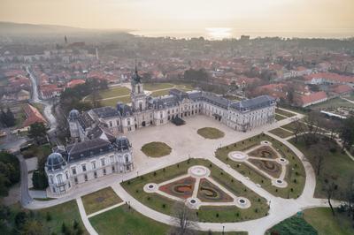 Aerial phooto of Festetics Castle in Keszthely, Hungary.A kastély és környéke madártávlatból. A Festetics-kastély Keszthely kiemelkedő jelentőségű műemléke. Építése még a 18. század közepén kezdődött el, ám csak az 1880-as években, nagyszabású átépítés és bővítés után nyerte el végleges formáját.-stock-photo