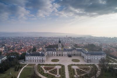 Aerial phooto of Festetics Castle in Keszthely, Hungary.A kastély és környéke madártávlatból. A Festetics-kastély Keszthely kiemelkedő jelentőségű műemléke. Építése még a 18. század közepén kezdődött el, ám csak az 1880-as években, nagyszabású átépítés és bővítés után nyerte el végleges formáját.-stock-photo