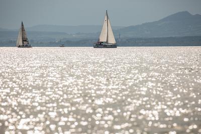 SZANTOD - JULY 18 : Sailing boats compete on 51.th Kekszalag championship at the Lake Balaton on 18 July 2019 in Szantod, Hungary.-stock-photo