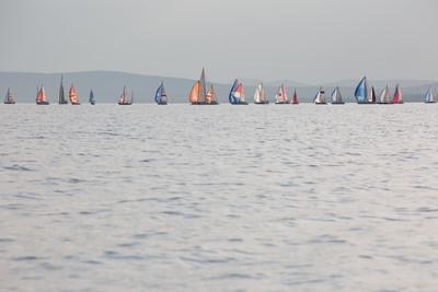 SZANTOD - JULY 18 : Sailing boats compete on 51.th Kekszalag championship at the Lake Balaton on 18 July 2019 in Szantod, Hungary.-stock-photo