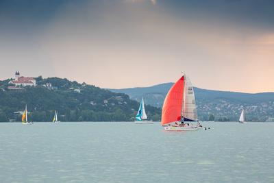 SZANTOD - JULY 18 : Sailing boats compete on 51.th Kekszalag championship at the Lake Balaton on 18 July 2019 in Szantod, Hungary.-stock-photo