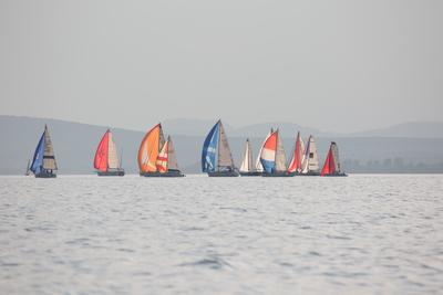 SZANTOD - JULY 18 : Sailing boats compete on 51.th Kekszalag championship at the Lake Balaton on 18 July 2019 in Szantod, Hungary.-stock-photo