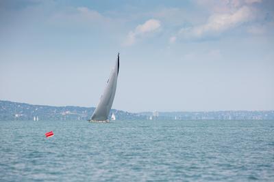 SZANTOD - JULY 18 : Sailing boats compete on 51.th Kekszalag championship at the Lake Balaton on 18 July 2019 in Szantod, Hungary.-stock-photo