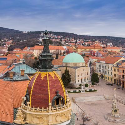 Aerial view of Pecs, Hungary with colorful rooftop of Megyehaza building-stock-photo