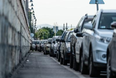 Many cars travelling on a road-stock-photo