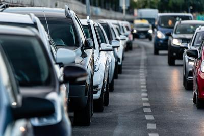 Many cars travelling on a road-stock-photo