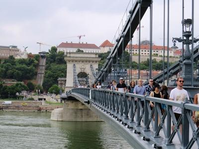 Tourists on the rebuilt Chain Bridge - Budapest - River Danube-stock-photo