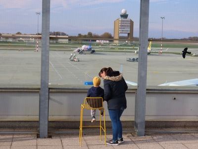 A child looks at the Child looking the palenes - Ferihegy Airport - Budapest-stock-photo