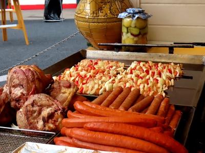 Sausage, pork knuckle, robber stakes and pickles at the Vörösmarty Square Christmas Market - Budapest-stock-photo