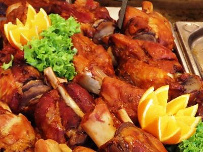 Gourmet food at the Vörösmarty square Christmas market - Pork knuckle - Budapest-stock-photo