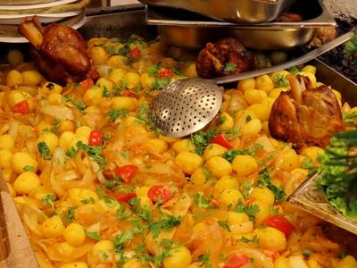 Gourmet food at the Vörösmarty square Christmas market - Pork knuckle with potatoes-stock-photo