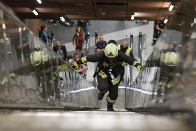 Firemen metro stair running competition in Budapest-stock-photo