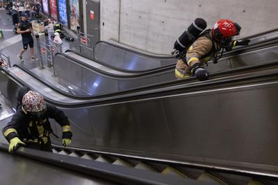 Firemen metro stair running competition in Budapest-stock-photo